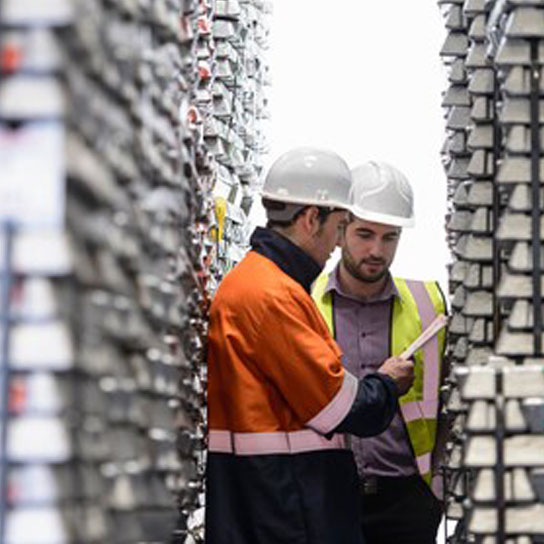 Men talking wearing hardhats